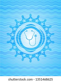 stethoscope icon inside sky blue water wave badge background.