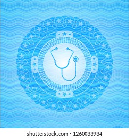 stethoscope icon inside water wave representation emblem.