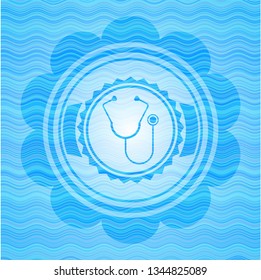 stethoscope icon inside water wave representation style badge.