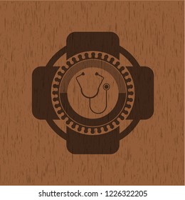 stethoscope icon inside wood emblem. Vintage.