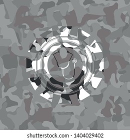 stethoscope icon on grey camouflage pattern
