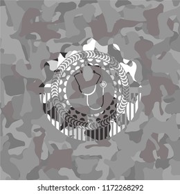 stethoscope icon on grey camouflaged texture