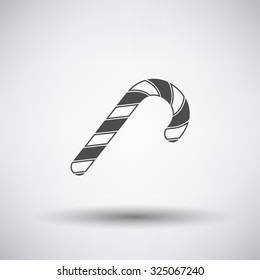 Stick candy icon on gray background with round shadow. Vector illustration.