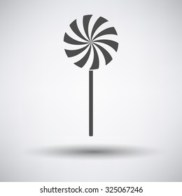 Stick candy icon on gray background with round shadow. Vector illustration.