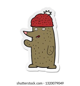 sticker of a cartoon bear in hat