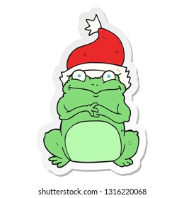 sticker of a cartoon frog wearing christmas hat