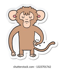 sticker of a cartoon monkey scratching