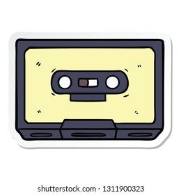 sticker of a cartoon old cassette tape