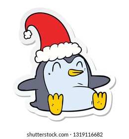 sticker of a cartoon penguin wearing christmas hat