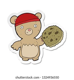 sticker of a cartoon teddy bear with cookie