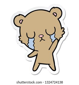 sticker of a crying cartoon bear waving