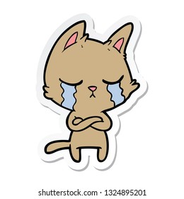 sticker of a crying cartoon cat with folded arms