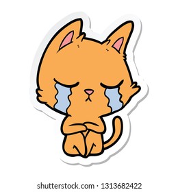 sticker of a crying cartoon cat sitting