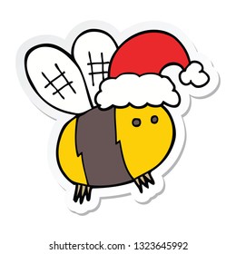 sticker of a cute cartoon bee wearing christmas hat