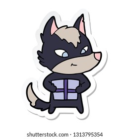 pegatina de un lobo de caricatura amistoso con regalo
