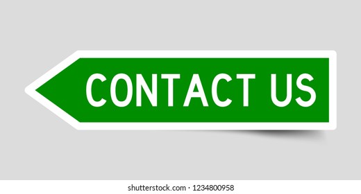 Sticker in green color arrow shape with word contact us on gray background