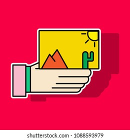 Sticker Hand holds photos icon . Multimedia, photo album app concept. Modern simple flat design for web banners, web site, infographics. Creative vector illustration