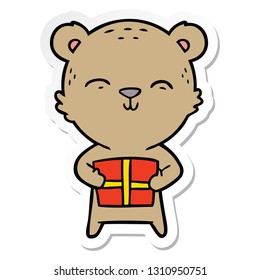 sticker of a happy cartoon bear with gift