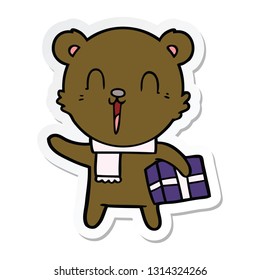 sticker of a happy cartoon bear with gift