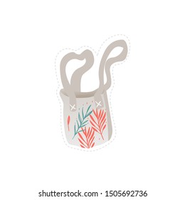 Sticker and icon of fabric canvas cotton shopping bag. The concept of fashion and accessories. Isolated flat vector illustration of a fabric bag with a floral print.
