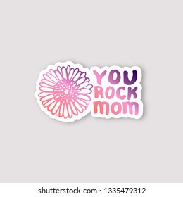 Sticker with mothers day hand lettering phrase and gerbera on white background. Living coral and deep violet colors. You rock mom. Vector illustration