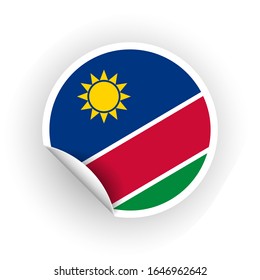 Sticker of Namibia flag with peel off corner isolated on white background. Paper banner or circle curl label sticker with flip edge. Vector color post note for advertising design.