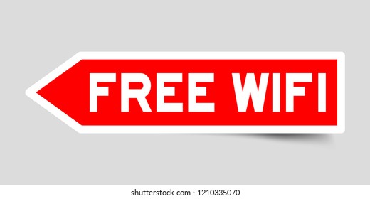 Sticker in red color arrow shape with word free wifi on gray background