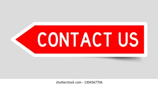 Sticker in red color arrow shape with word contact us on gray background