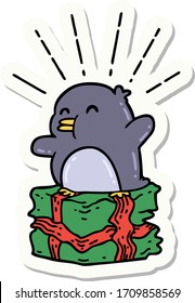 sticker of a tattoo style penguin sitting on present