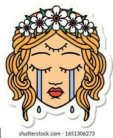 sticker of tattoo in traditional style of female face with third eye and crown of flowers cyring