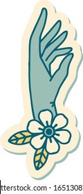 sticker of tattoo in traditional style of a hand and flower