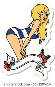 sticker of tattoo in traditional style of a pinup girl in swimming costume with banner