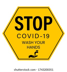 Sticker with the text: Stop COVID-19 wash your hands. Yellow and black sticker. Stop Sign.