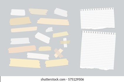 Sticky, adhesive masking tape, ripped note paper stuck on gray background