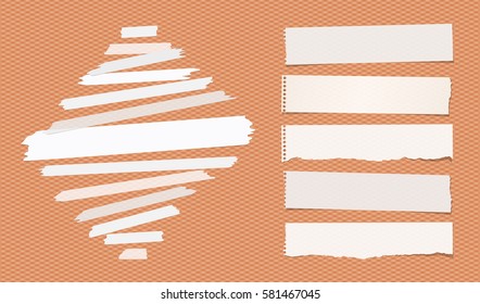 Sticky, adhesive masking tape, ripped note paper strips stuck on squared orange background