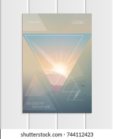 Stock vector brochure A4 or A5 format design business template with abstract triangles and mountain landscape at sunset, dawn backgrounds for printed material, element web site, card, cover, wallpaper