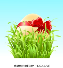 Stock Vector Easter egg with a bow in the grass