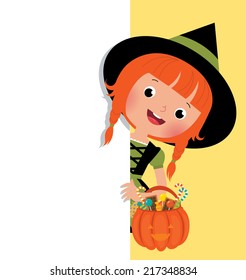 Stock vector illustration of a cute little witch in Halloween costume with a basket of holiday sweets peeping from behind a blank white banner