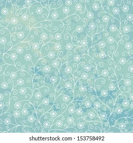 Stock vector seamless pattern with swirls and snowflakes on a blue background.