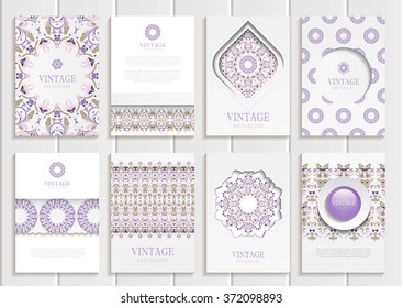 Stock vector set of brochures in vintage style. Design templates golden, purple floral frames, ornaments, patterns and white backgrounds. Use for printed materials, signs, elements, web sites, cards