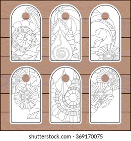 stock vector set of label with floral pattern on the wood background. template