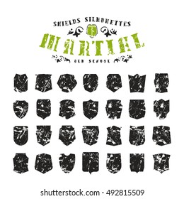 Stock vector set of shields silhouettes with shabby texture