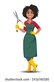Stock vector young African American gardener woman. Beautiful lady farmer cartoon character standing with gardening scissors 