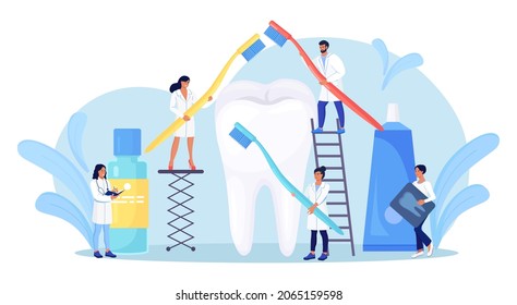 Stomatology, dentistry. Tiny Dentists standing around big tooth and cleaning, treating unhealthy teeth with caries cavity. Doctors brushing, clean plaque. Dental examination. Dentist appointment