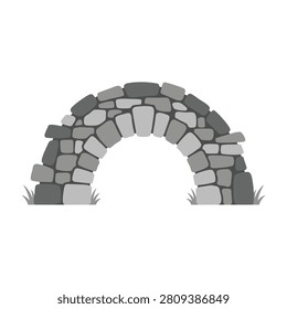 A stone archway made of rocks outdoors with grass