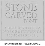 Stone Carved font. Alphabet on rock plate. Chips and scratches. Ancient ABC. Archaic letters
