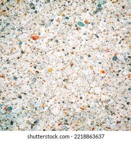 Stone texture. Vector illustration. Cut of white stone interspersed with colored gems - orange and blue. Repeating texture of white rough surface.