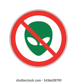 Stop aliens road sign. A green alien face crossed by a red stripe in a circle.