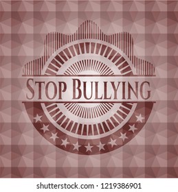 Stop Bullying red badge with geometric pattern background.