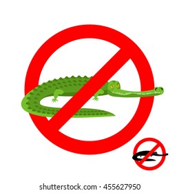 Stop crocodile. Prohibited alligator. Strikethrough caiman. Emblem against predator reptile. Red prohibition sign. Ban wild aggressive amphibian